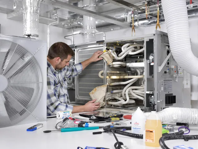 Carver Air Duct Cleaning specialist performing precision AC coil cleaning in Carver