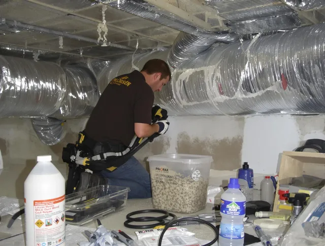 Carver Air Duct Cleaning specialist performing professional mold removal from air ducts in Carver