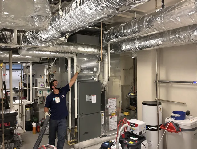 Carver Air Duct Cleaning specialist performing thorough furnace duct cleaning in a Carver residence
