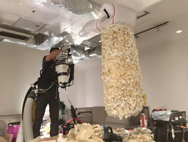 Carver Air Duct Cleaning technician performing precision vacuum insulation removal in a residential property in Carver