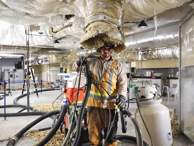 Professional vacuum insulation removal by Carver Air Duct Cleaning expert in Carver
